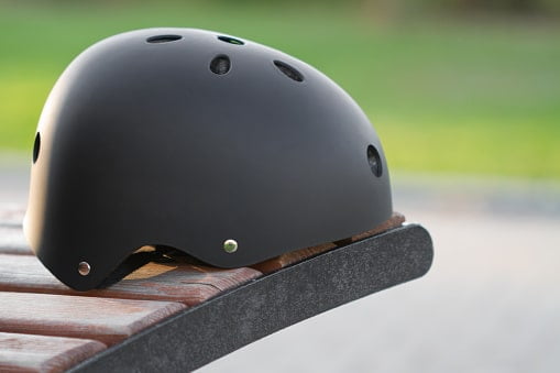 black safety helmet for segway on the green grass background